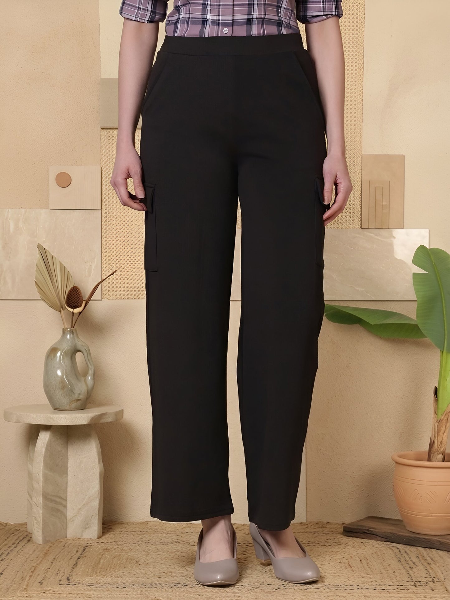 Women solid high-rise cargo style trousers from Fithub Fashion, featuring a relaxed fit and multiple cargo pockets.