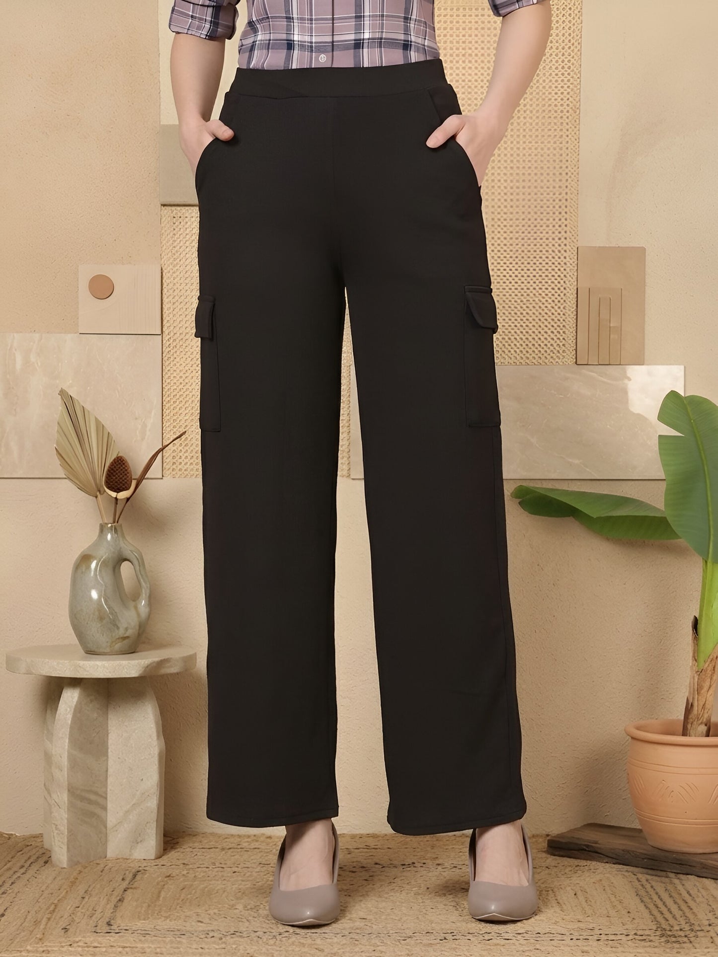 Women’s solid high-rise cargo-style trousers by Fithub Fashion, featuring a relaxed fit and multiple cargo pockets.