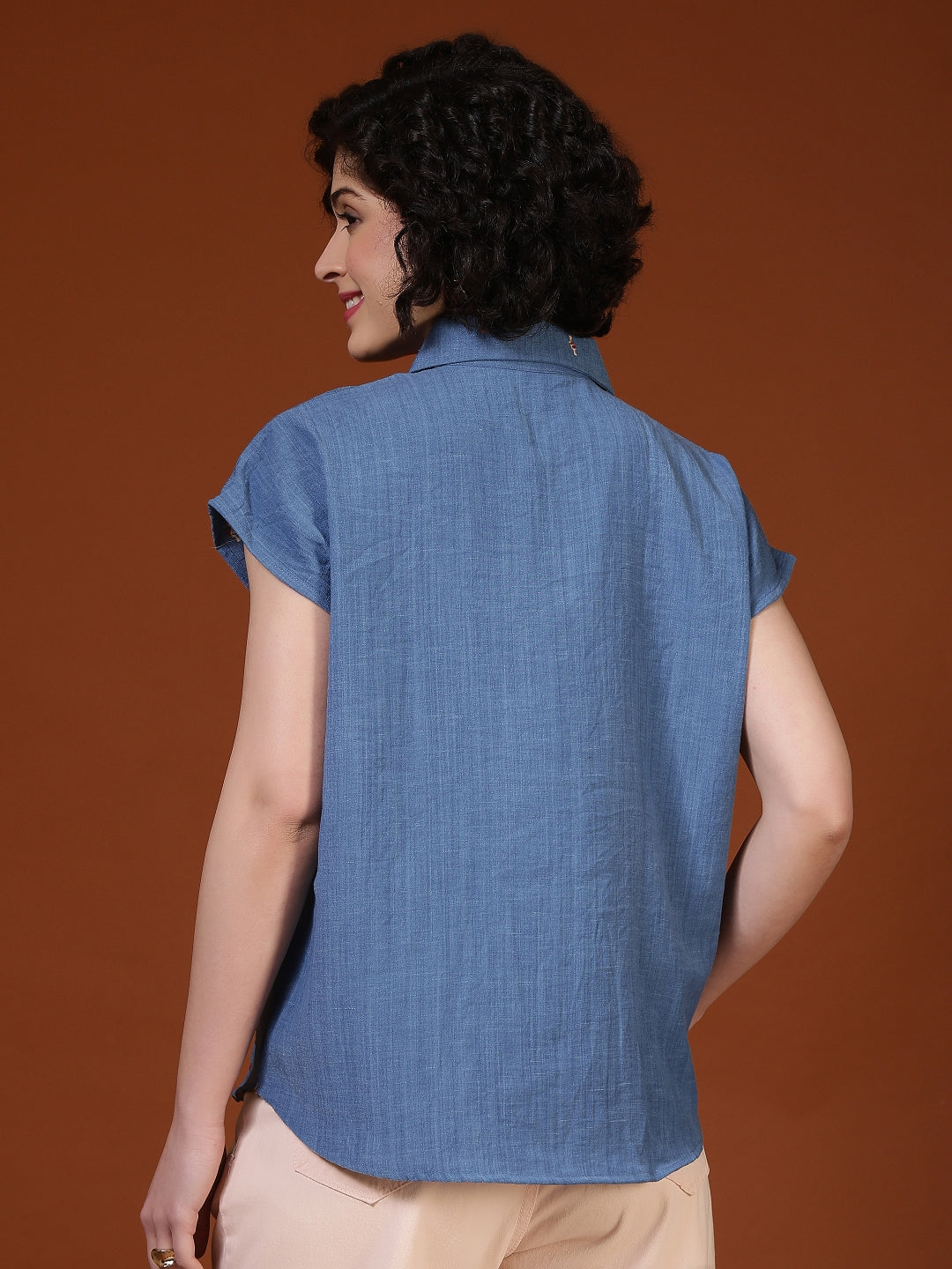 Women’s embroidered oversized casual shirt by Fithub Fashion, featuring colorful embroidery and relaxed fit, styled with rolled sleeves.